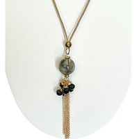 Bijoux | Collier pendentif une bille marbrée et des chaînes dorées garnies de pierres noires